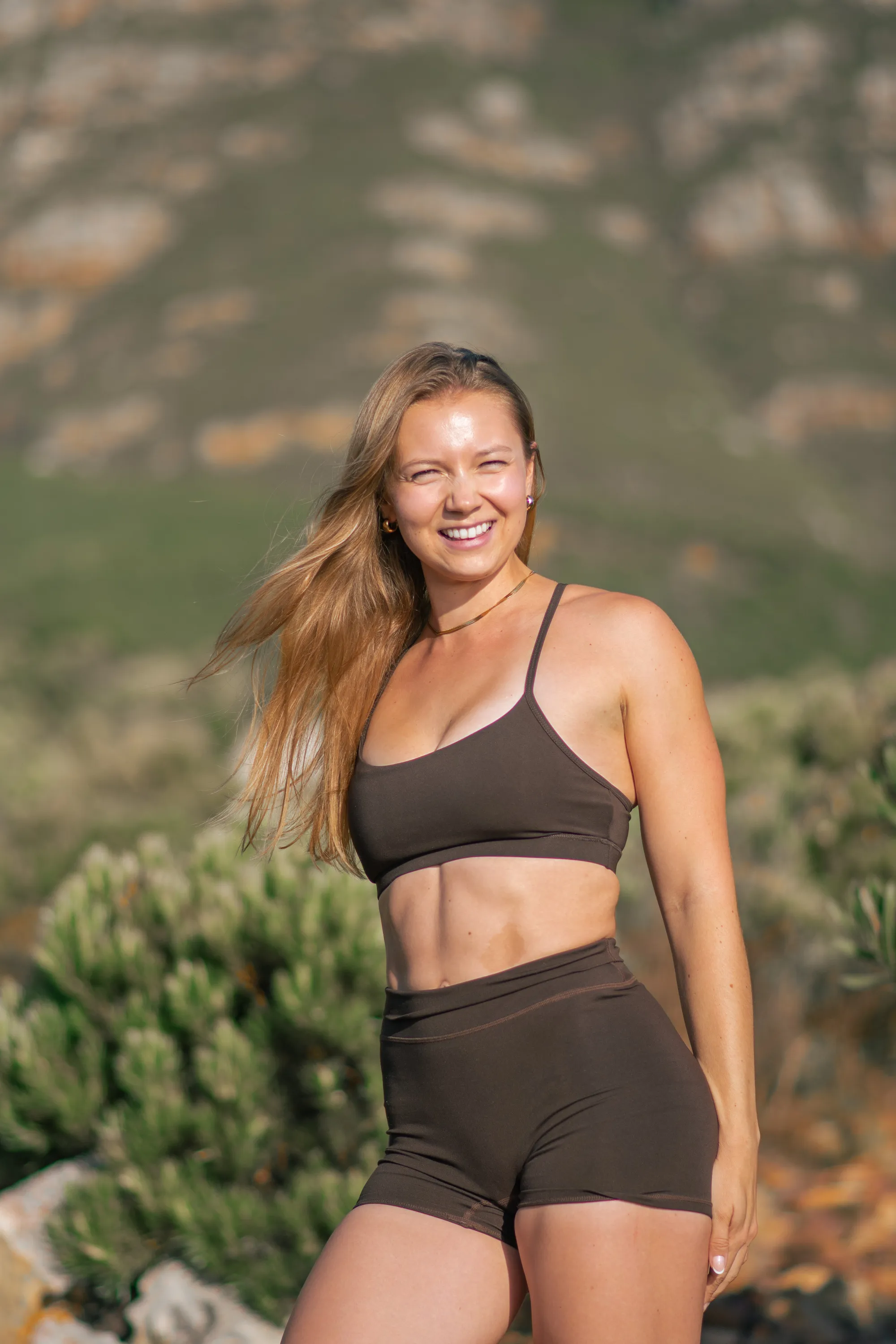 Madison showing athletic physique, smiling and confident